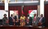 Ministers of Mining, Monica Chang'anamuno, Finance Simplex Chithyola Banda and Representative of the mining companies during the signing ceremony of MDAs in Lilongwe